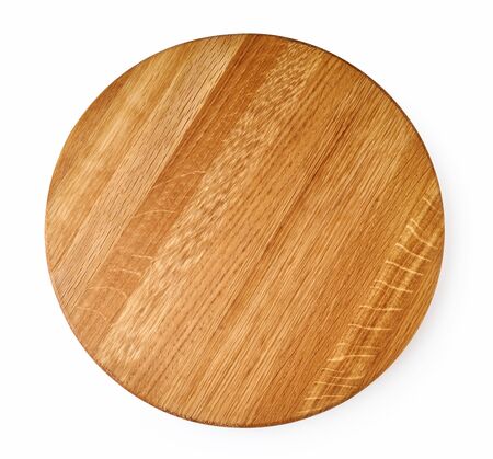 Round wooden board isolated on white background. Top view of chopping board.の写真素材