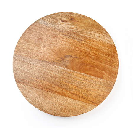 Round wooden board isolated on white background. Top view of chopping board.の写真素材
