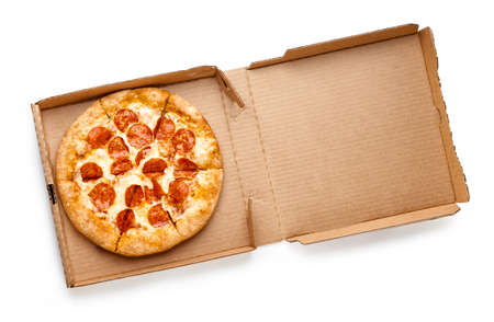 Pizza in a cardboard box isolated on white background. Top view of pizza package.の写真素材