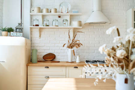 Kitchen wooden table top and kitchen blur background interior style scandinavianの写真素材