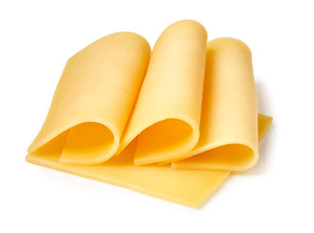 Cheese slices isolated on white backgroundの写真素材