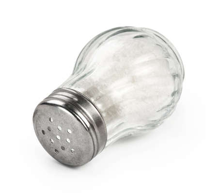 Salt shaker isolated on white background. Salt in glass bottle.の写真素材
