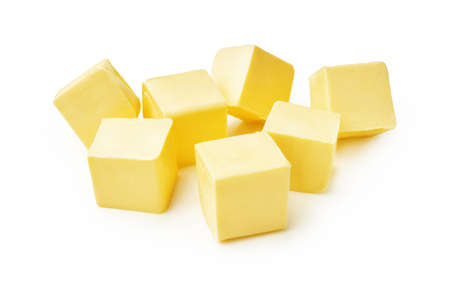 Pieces of butter isolated on white background. Butter cubes.の写真素材