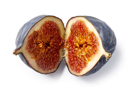 Halves of fig fruit isolated on white background. Top view of fig slicesの写真素材