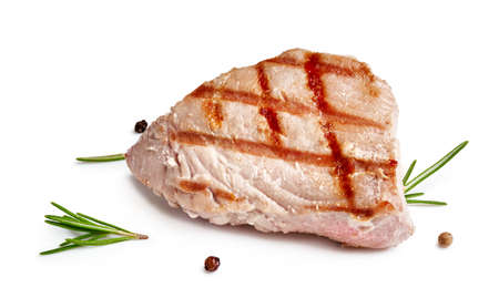 Grilled tuna steak with rosemary and spices isolated on whiteの写真素材