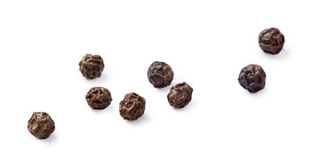 Black peppers isolated on white. Spices. Macro.の写真素材
