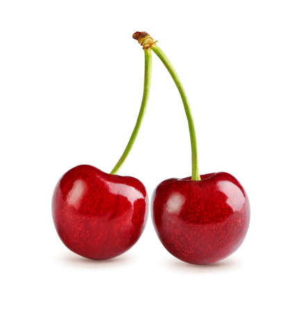 Two cherries with cherry leaf isolated on white.の写真素材