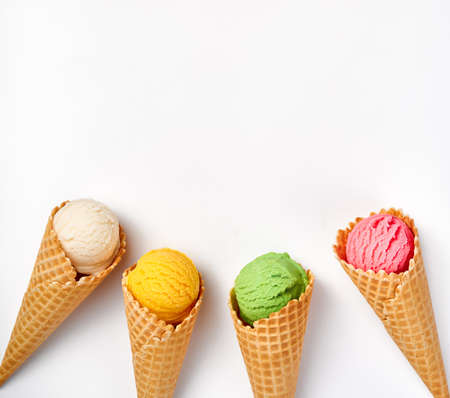 Assorted of ice cream in cones on white background. Colorful set of ice cream of different flavours. Ice cream isolated for your designの写真素材