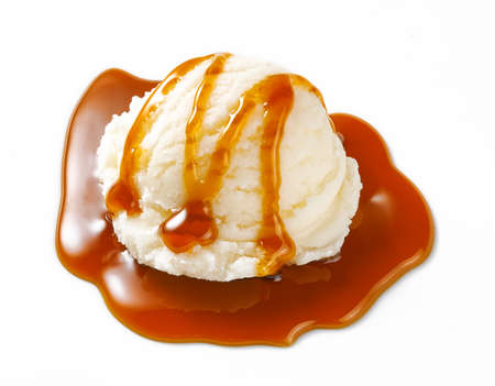 Scoop of ice cream with caramel sauce isolated. Ice cream on white background. Perfect image for package design of ice cream.の写真素材