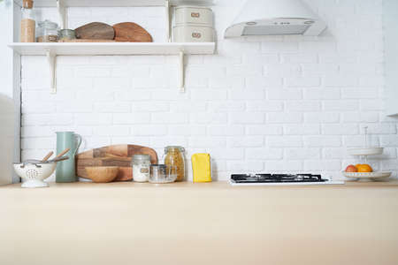Kitchen wooden table top and kitchen blur background interior style scandinavianの写真素材