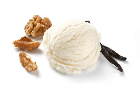 Scoop of vanilla ice cream with walnuts on white background. Ice cream with vanilla isolated. Ice cream for package design.の写真素材