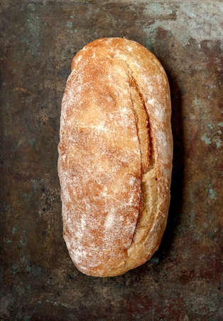 Organic bread ciabatta on vintage metallic tray. Top view of homemade ciabatta. Flat lay.