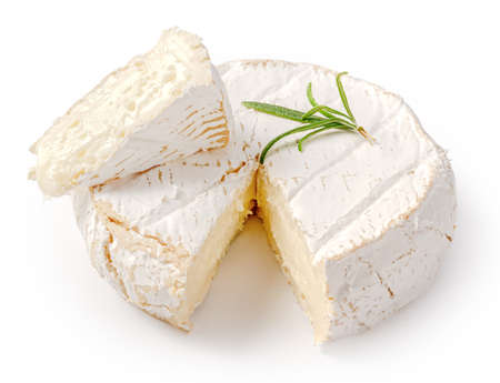 Fresh camembert cheese with sliced camembert isolated. Camembert cheese piece with rosemary on white background.の写真素材