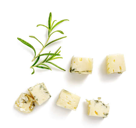 Pieces of blue cheese with rosemary isolated. Blue cheese on white background. Sliced blue cheese for package design.の写真素材