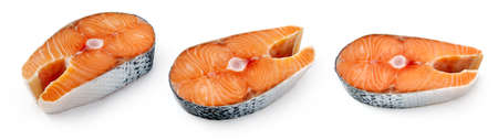 Set of salmon pieces on white background. Salmon steaks isolated.の写真素材