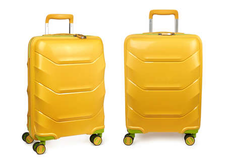 Set of two suitcases. Yellow suitcases isolated on white backgroundの写真素材