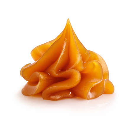 Soft caramel isolated. Melted caramel on white.の写真素材