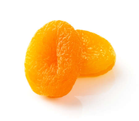 Two dried apricots isolated on white background. Dried apricots.の写真素材