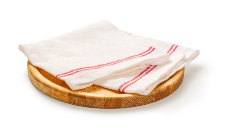 Napkin and board for pizza on white background. White napkin on wooden round board isolated.の写真素材