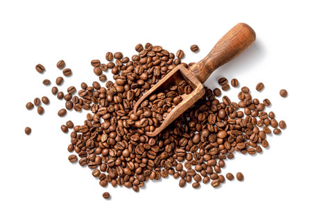 Scoop of coffee beans on white background. Coffee in scoop isolated. Top view of coffee.の写真素材