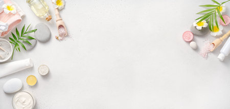 Beauty and spa concept on white concrete background. Banner. Blue clay with cream and massage stones. Massage concept.の写真素材