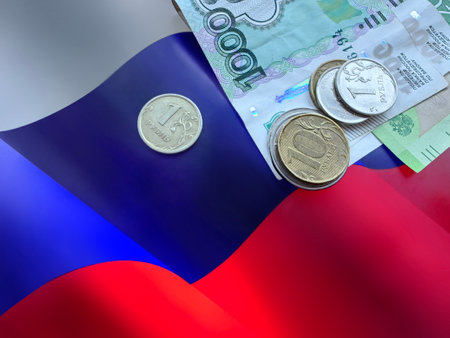 Money and coins on flag of Russia. Economic and finance of Russian Federation, negative impact of western sanctions on Russia financial systemの写真素材