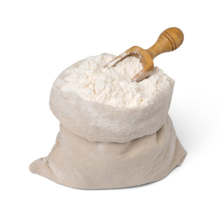 Bag with flour and wooden scoop isolated.の写真素材