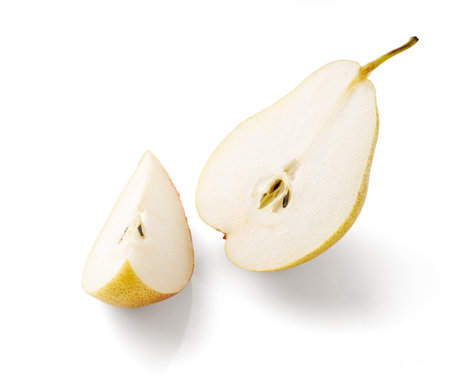 Sliced pear isolated. Half of pear on white.の写真素材