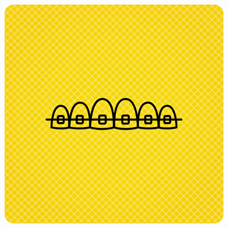 Dental braces icon. Teeth healthcare sign. Orthodontic symbol. Linear icon on orange background. Vectorのイラスト素材