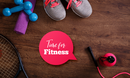 Fitness gym equipment. Tennis racket. Sneakers, dumbbells with towel and skipping rope. Time for fitness speech bubble.の写真素材