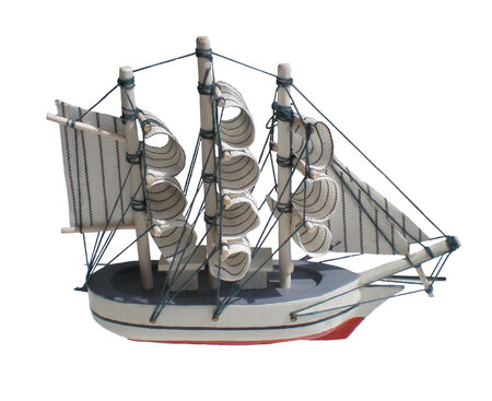 The toy sailing ship is isolated on a white background.の写真素材