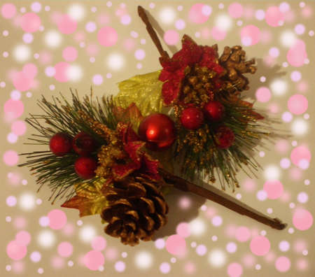 On a beige gentle background there are beautiful branches with Christmas ornaments.The background has effect bokeh.の写真素材