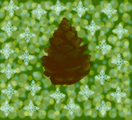 The green background with snowflakes and the brown cone has effect bokeh.の写真素材