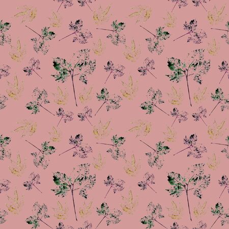 On a pale pink background is a seamless pattern of multi-colored leavesの写真素材