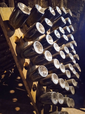 Wine bottles in the cellar of a winery. Wine productionの写真素材