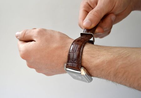 Fastening leather wrist watch strap isolated on white backgroundの写真素材