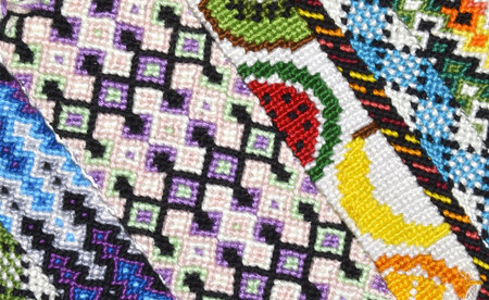 Multi-colored bright background with unusual pattern handmade of thread and knots