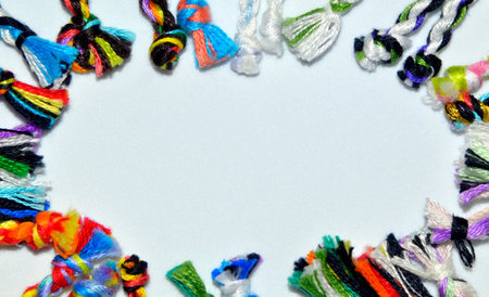 Frame made of woven colorful handmade ties of bracelets