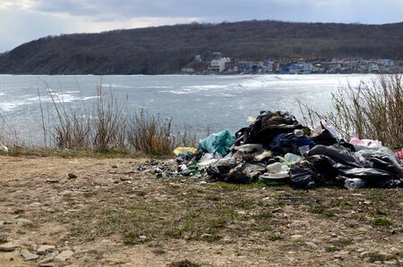 A pile of garbage left on the shore of the Sea of ââJapan after people rest. environmental pollution conceptの写真素材