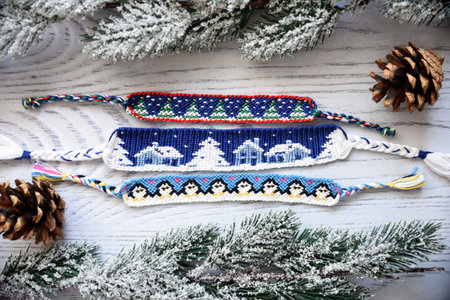 Woven friendship bracelets with alpha patterns Snowy night with houses,penguins, fir trees. Handmade...