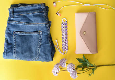 Set of clothes and accessories on yellow backgroundの写真素材