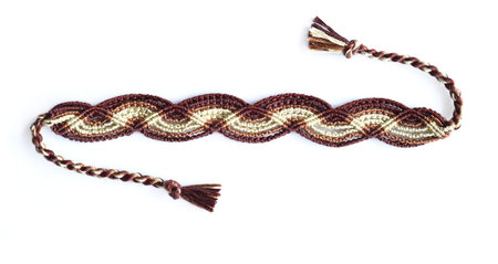 DIY woven brown friendship bracelet with unusual braiding. Summer accessory