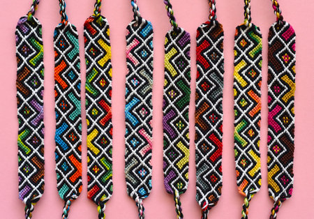 DIY woven friendship bracelets with abstract geometric pattern. Summer accessoriesの写真素材