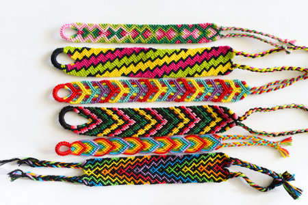 DIY woven friendship bracelets with unusual braiding. Summer accessoryの写真素材