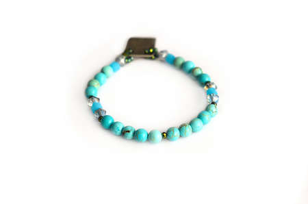 Turquoise round beads bracelet isolated on white backgroundの写真素材