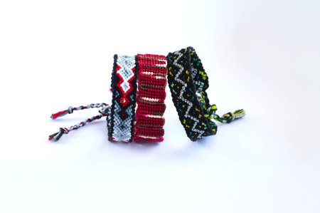 DIY woven friendship bracelets with unusual braiding. Summer accessoryの写真素材