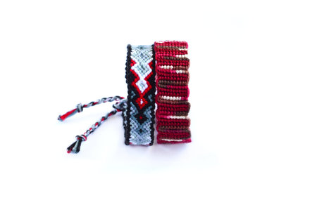 DIY woven friendship bracelets with unusual braiding. Summer accessoryの写真素材