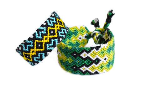 DIY woven friendship bracelets with unusual braiding. Summer accessoryの写真素材