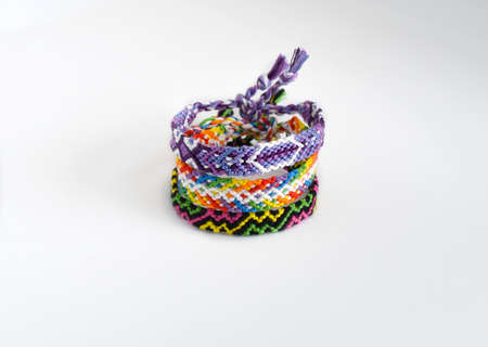 DIY woven friendship bracelets with unusual braiding. Summer accessoryの写真素材