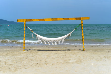 Hammock on a sandy beach in Vietnamの写真素材